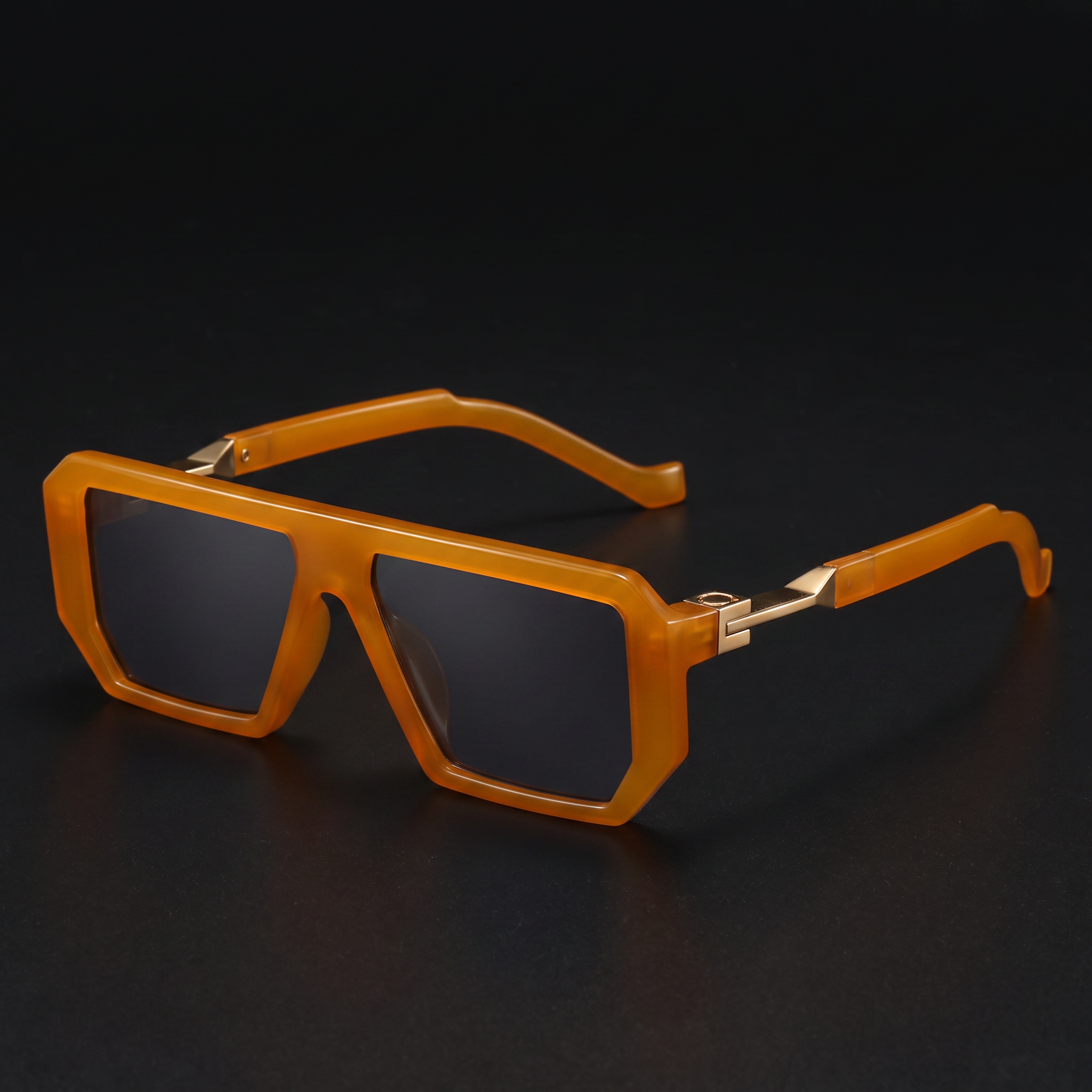 Bold square sunglasses in amber orange with gold accents — Swervy hip-hop shades