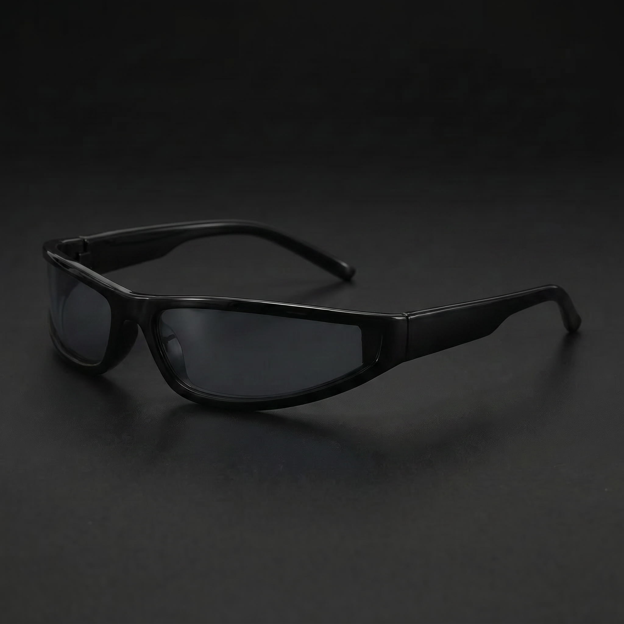 Narrow Rectangle Y2K sunglasses in Black/Grey colorway, black studio close-up, three-quarter view facing left