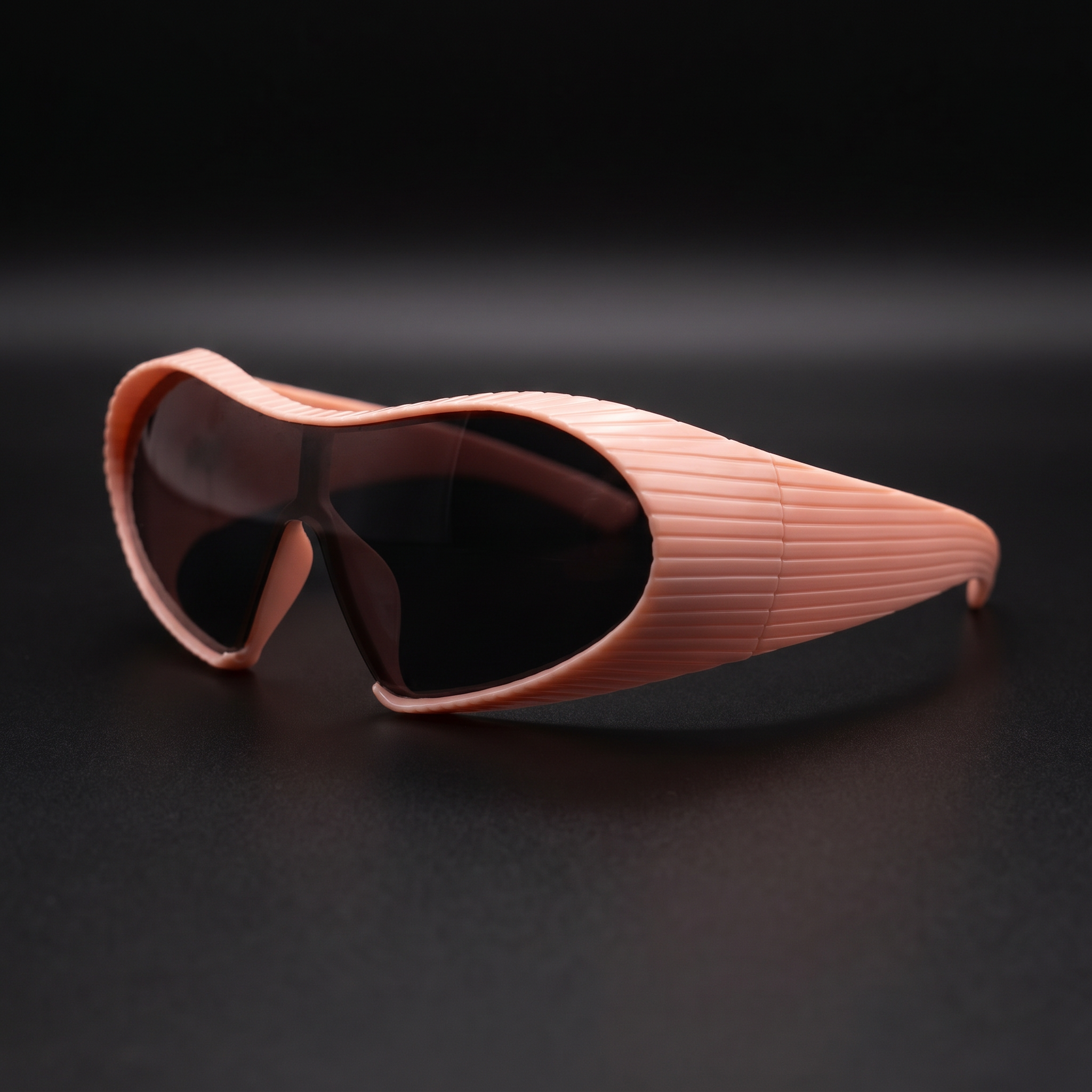 Alien Wrap Shield sunglasses pink colorway studio close-up