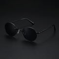 Round rimless clip-on sunglasses black colorway studio close-up