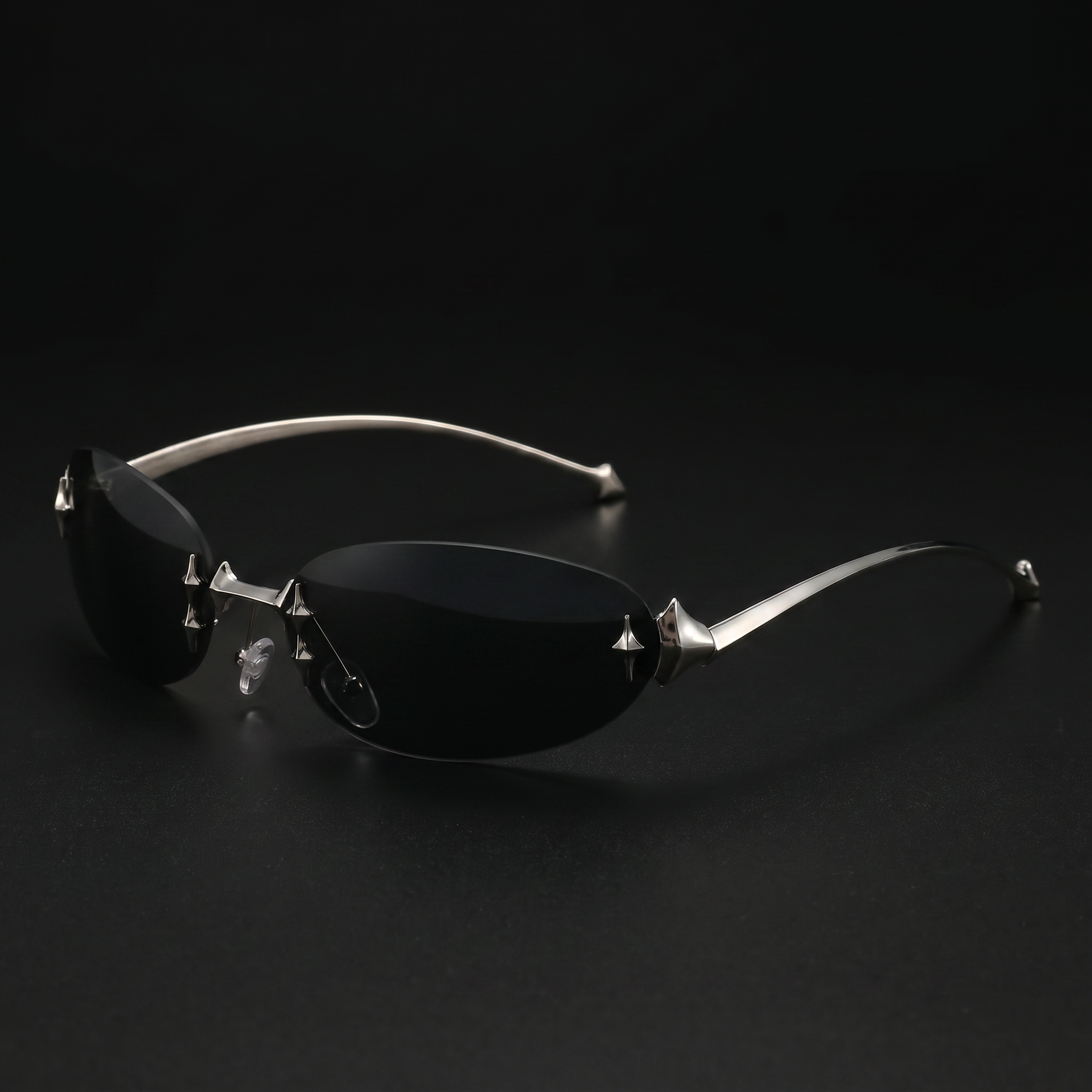 Chrome Star oval Y2K sunglasses gray colorway studio close-up