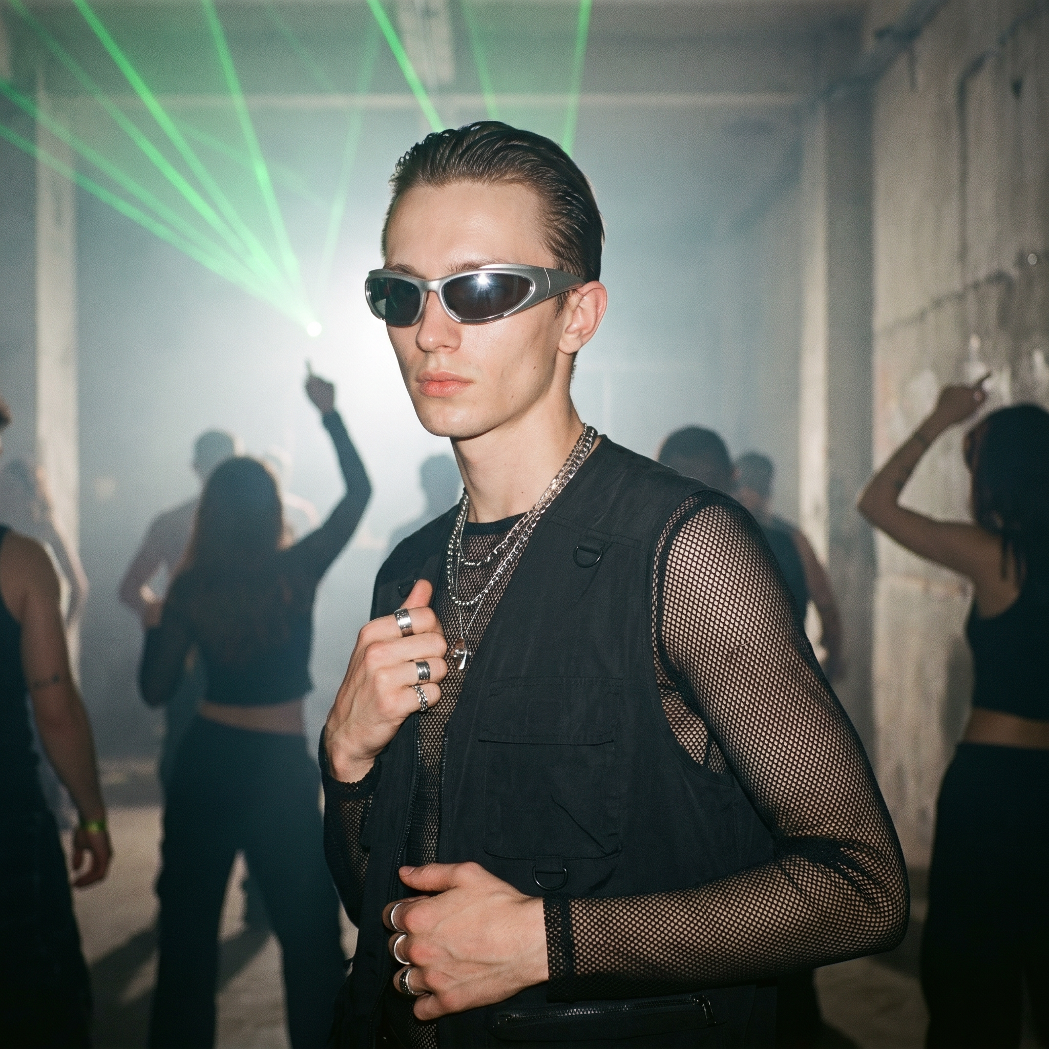 Y2K Speed Wrap sunglasses in silver mirror worn at a warehouse afterparty