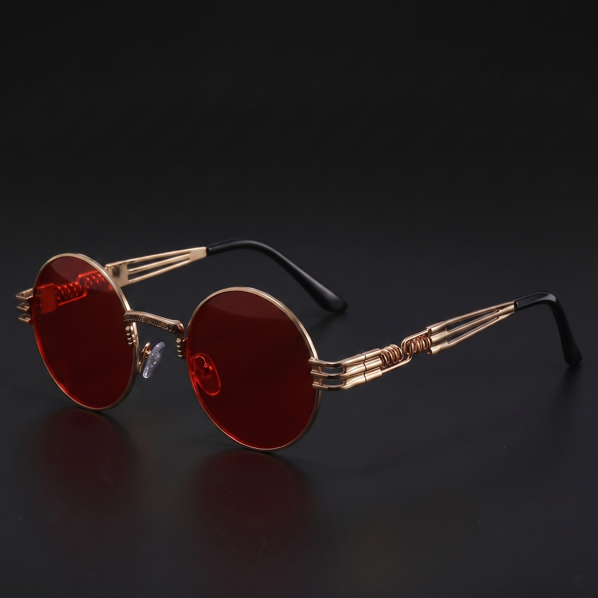 Gold round steampunk sunglasses with red lenses and spring-temple frame
