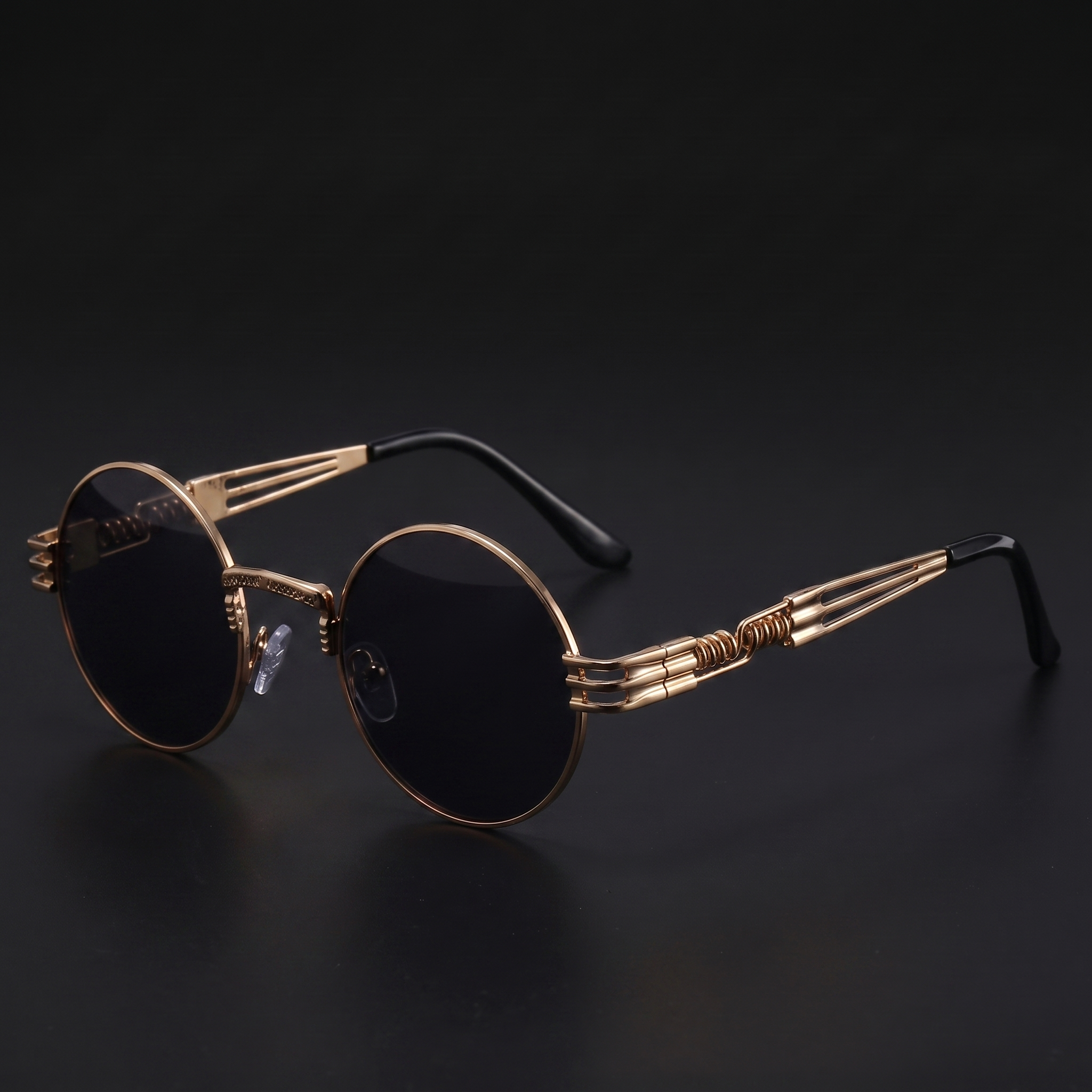 Gold round steampunk sunglasses with dark smoke lenses and spring temples