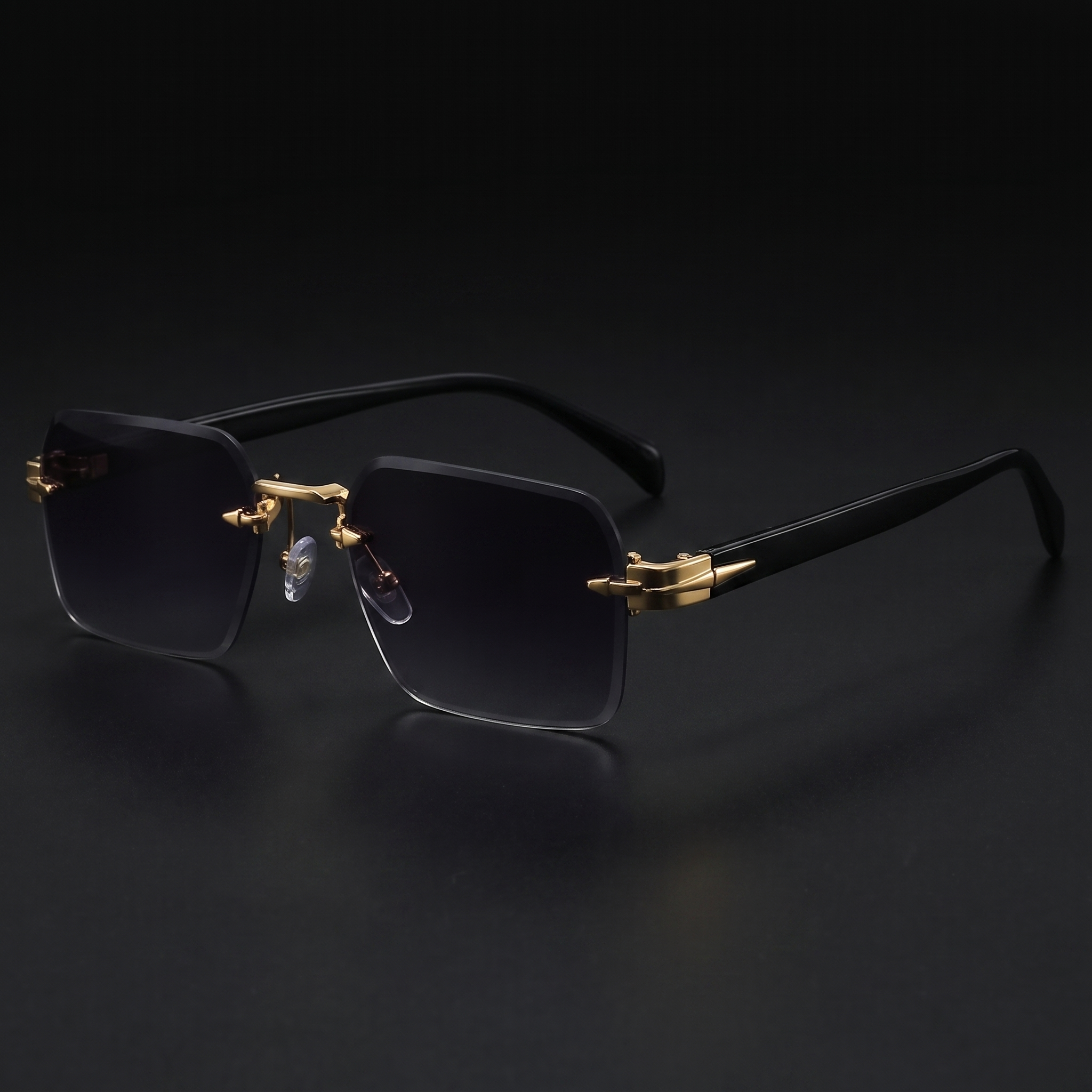 Rimless gradient sunglasses close-up in Double Grey, gold hardware and black temples