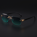 Rimless gradient sunglasses close-up in Gold Green, gold spearhead hardware and black temples