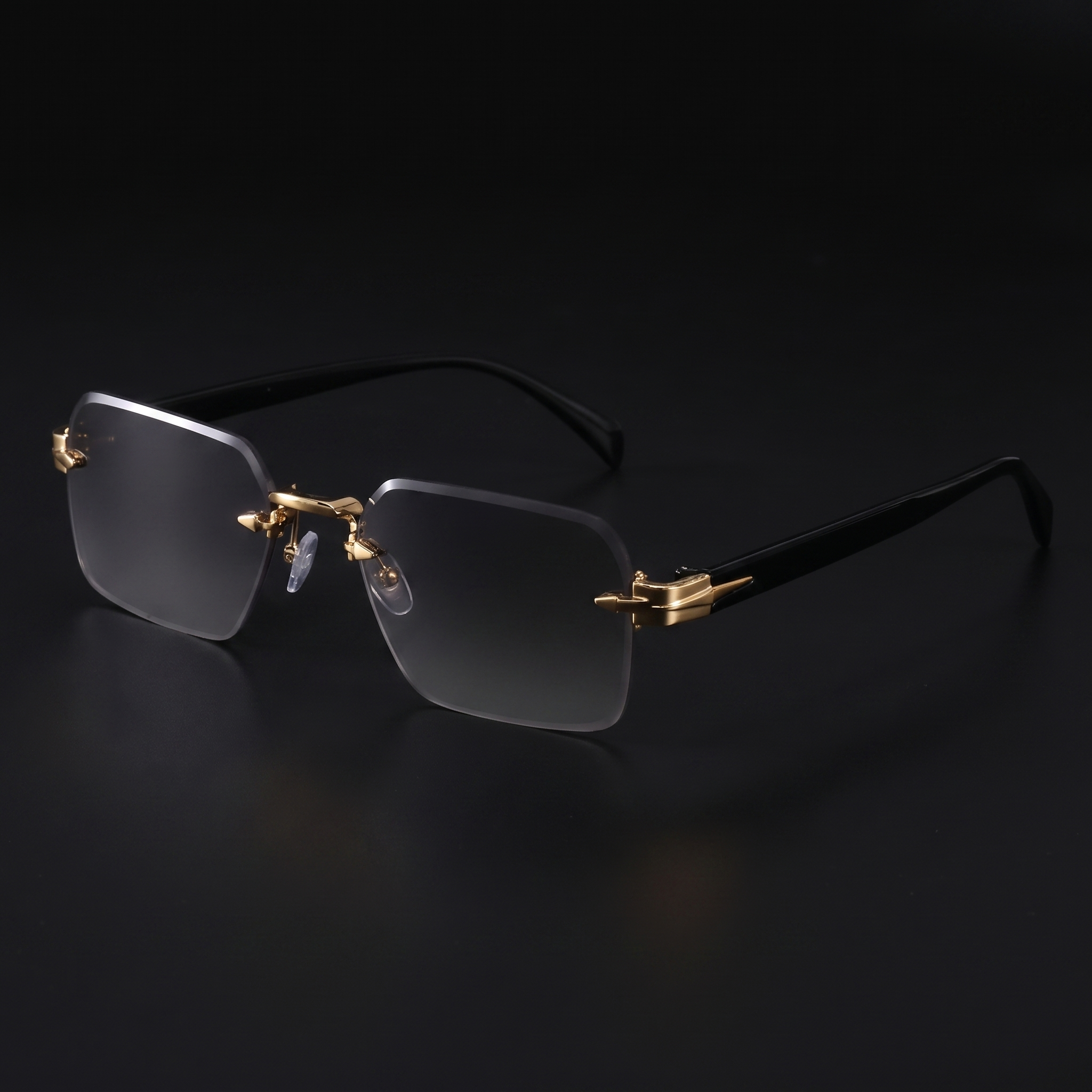 Rimless gradient sunglasses close-up in Gold Grey, gold hardware and black temples