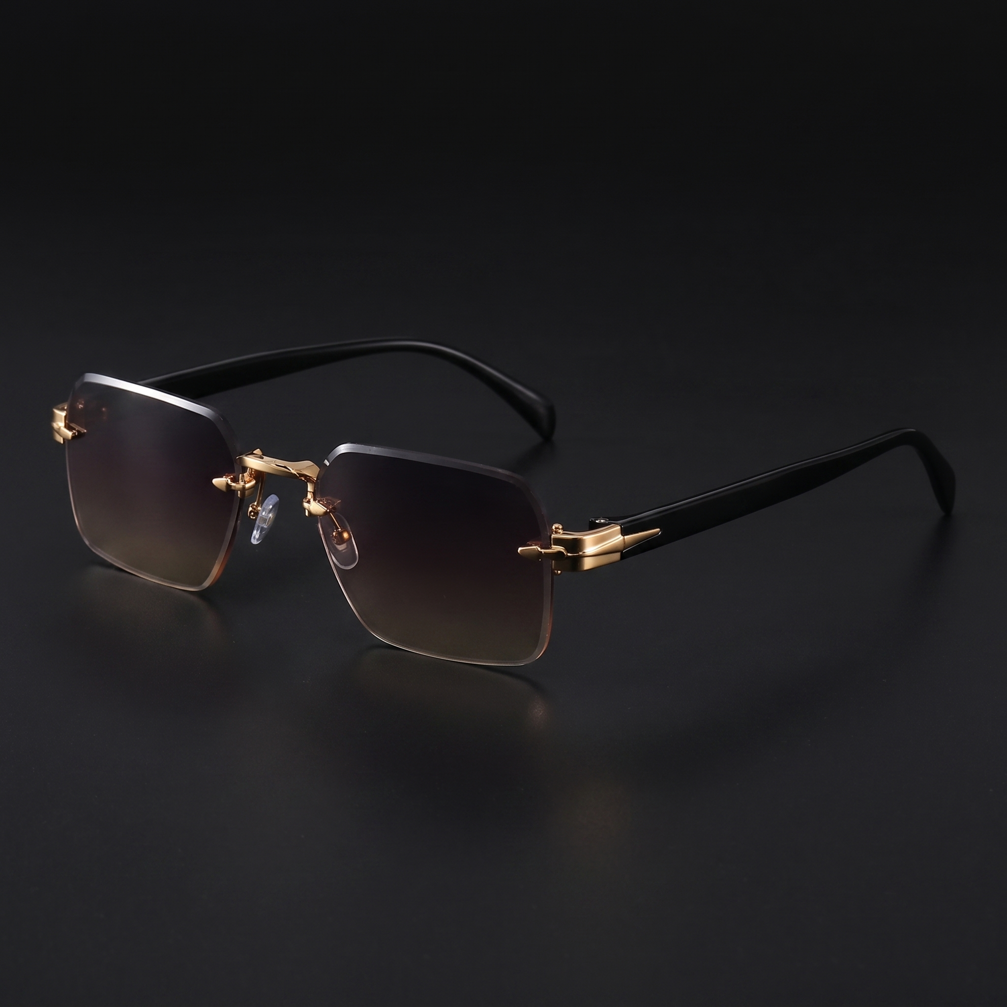 Rimless gradient sunglasses close-up in Grey Brown gradient, gold hardware and black temples