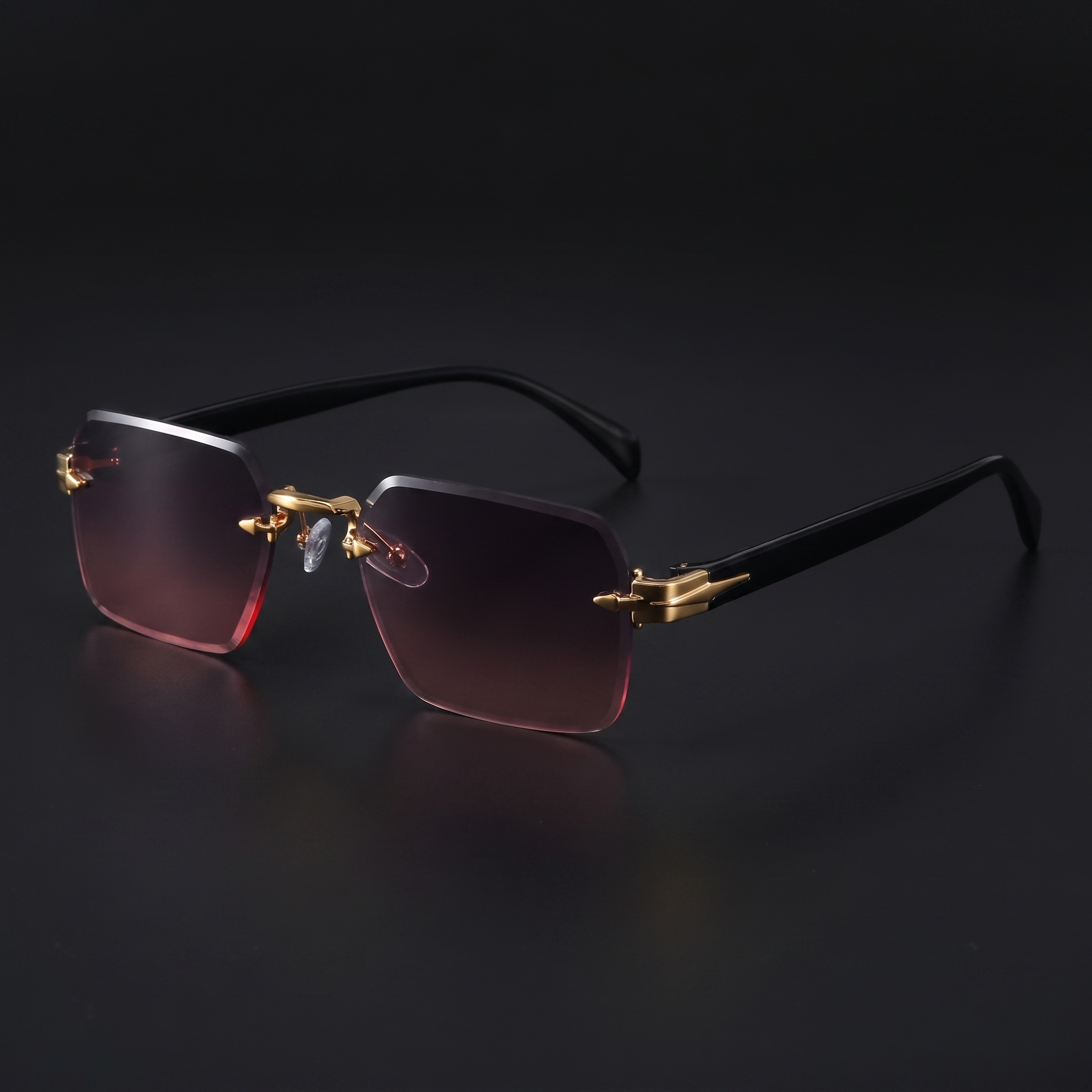 Rimless gradient sunglasses close-up in Grey Pink dusk violet-to-pink gradient, gold hardware