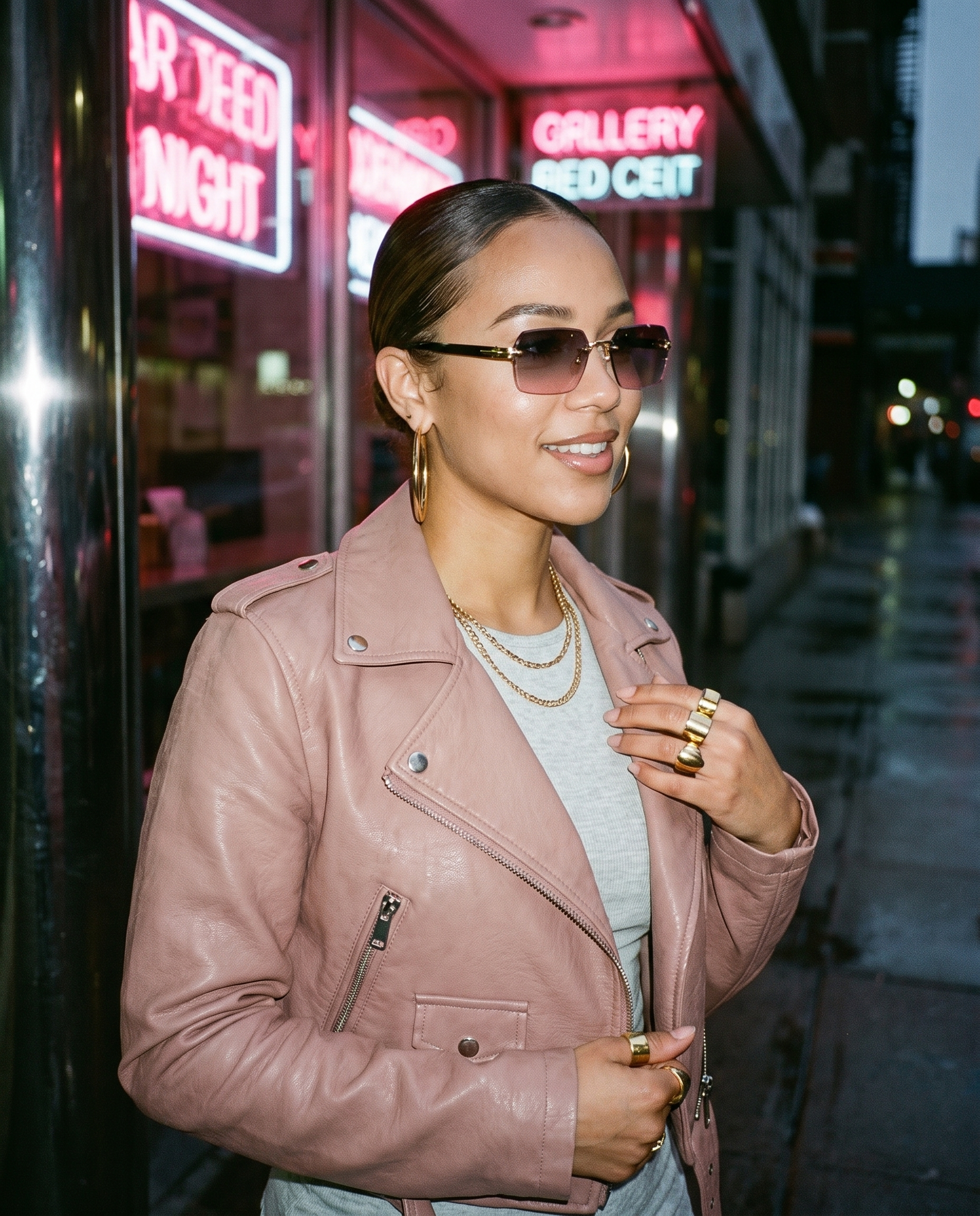 Rimless gradient sunglasses in Grey Pink dusk lenses worn on a neon city street at night, hip-hop streetwear