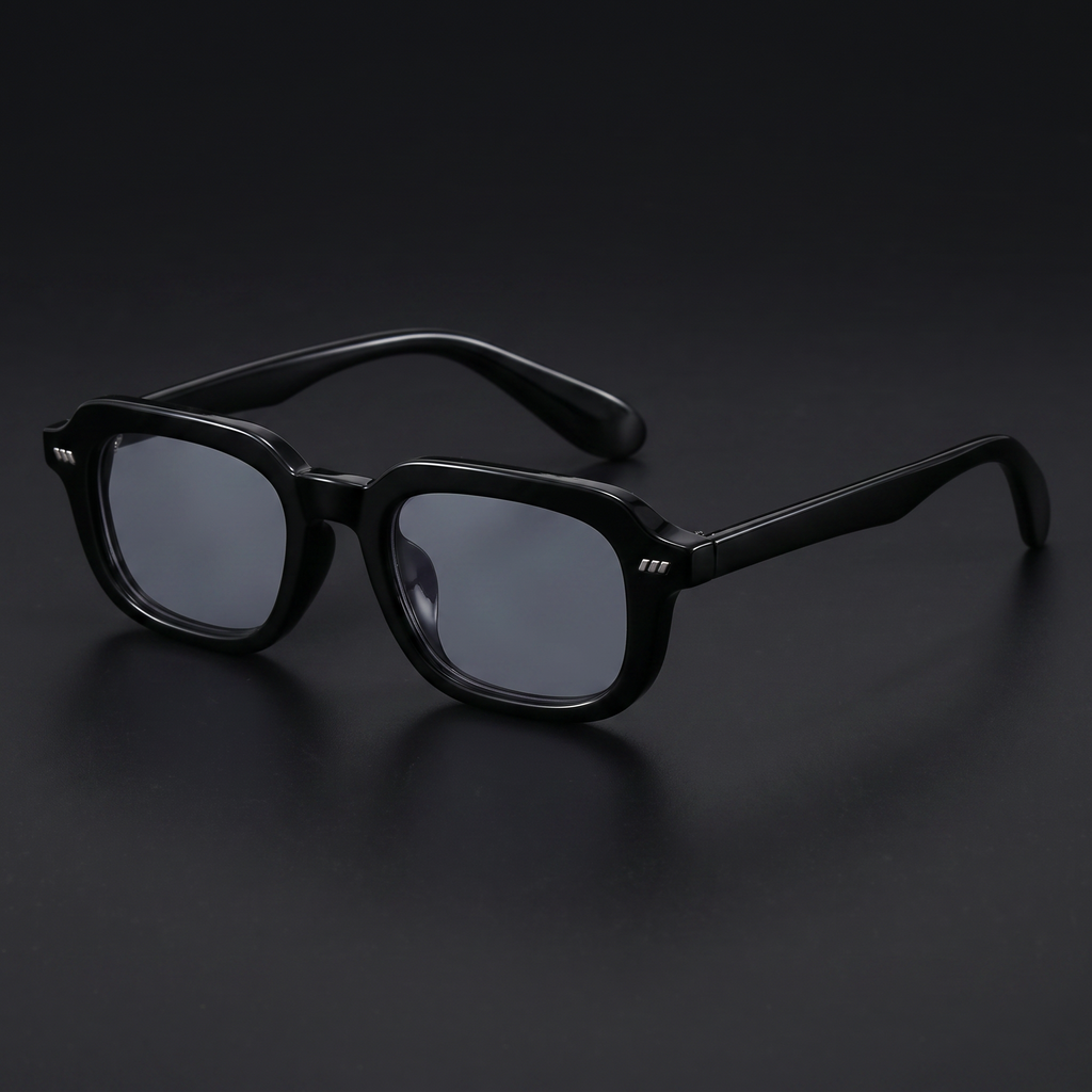 Small square Y2K sunglasses in black with smoke-grey lenses, studio close-up