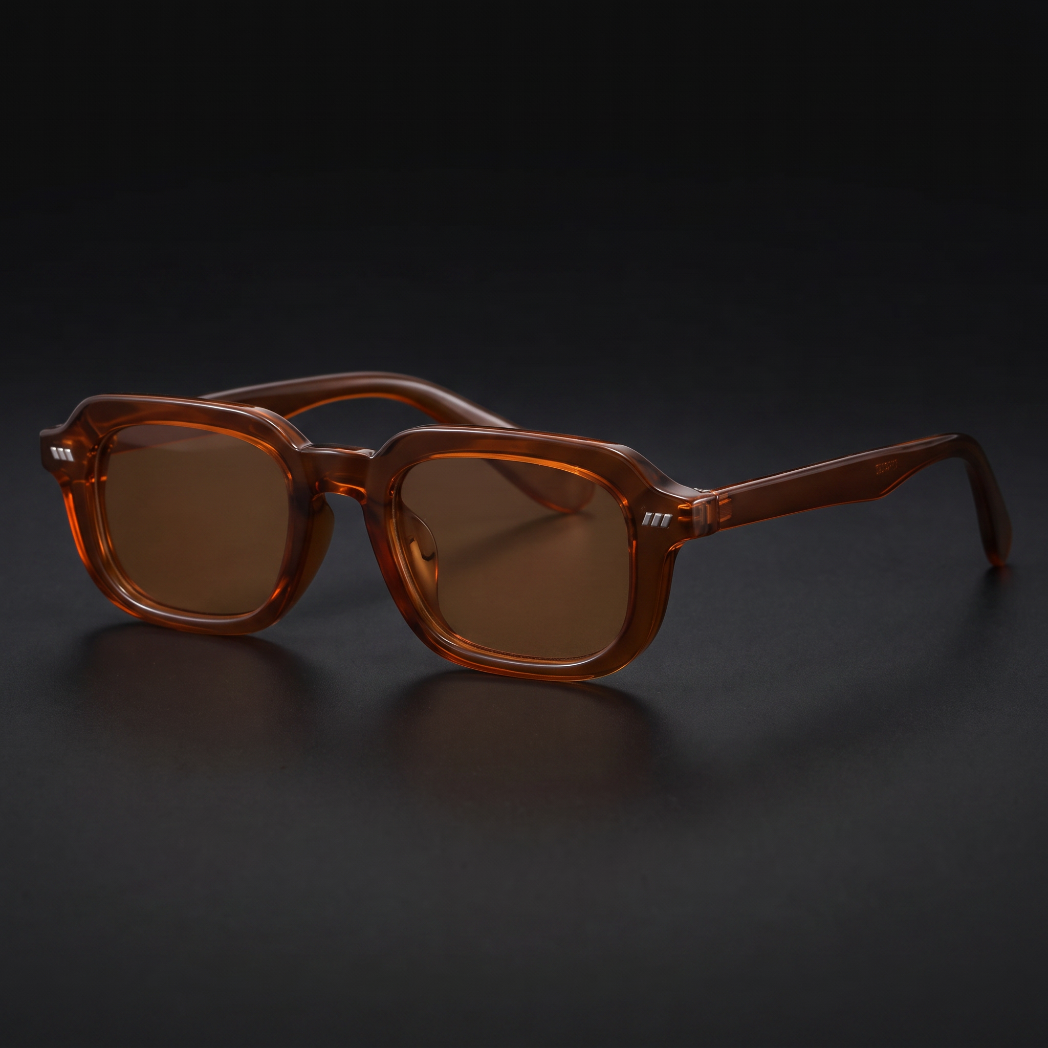 Small square Y2K sunglasses in brown with brown lenses, studio close-up